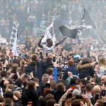 Thousands of ecstatic Derby fans invade pitch after sealing promotion back to Championship after two-year absence