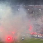 French league match ABANDONED as fans protest with flares and players throw them back into stands in chaotic scenes